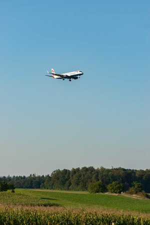Zurich, Switzerland, September 6, 2023 G-LCAE British Airways Embraer E190-LR aircraft is landing on runway 14のeditorial素材