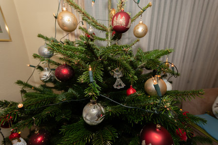 Ruggell, Liechtenstein, December 24, 2022 Christmas fir tree decorated with beautiful ornamentsの写真素材