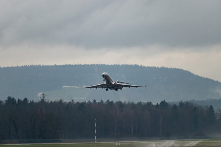 Zurich, Switzerland, January 17, 2024 9H-VJP Vista Jet Bombardier Global 6000 aircraft is taking off from runway 16 on a rainy day during the world economic forum in Davosのeditorial素材