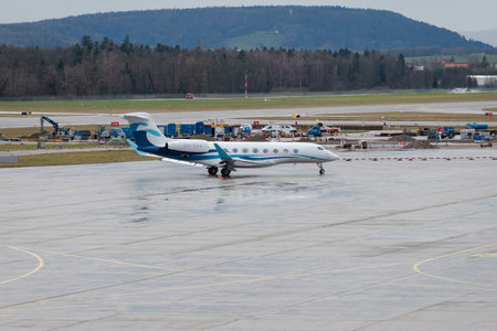Zurich, Switzerland, January 18, 2024 9H-CAA Avcon Jet Malta Gulfstream G650 aircraft is taxiing in the rain after the world economic forum in Davosのeditorial素材