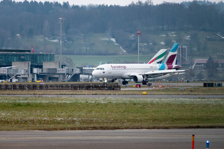 Zurich, Switzerland, January 15, 2024 D-AEWF Eurowings Airbus A320-214 aircraft is taxiing to its positionのeditorial素材