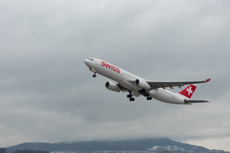 Zurich, Switzerland, January 17, 2024 HB-JHA Swiss international airlines Airbus A330-343 aircraft is taking off from runway 16 on a rainy dayのeditorial素材