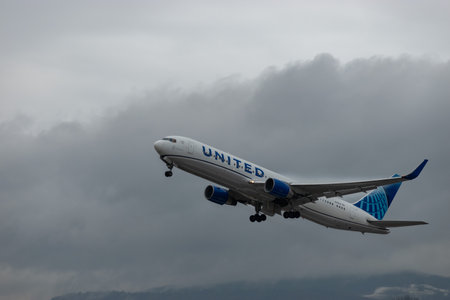 Zurich, Switzerland, January 17, 2024 N-666UA United airlines Boeing 767-322ER aircraft is departing from runway 14 during a rain showerのeditorial素材