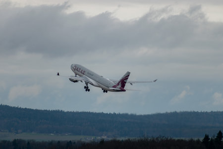 Zurich, Switzerland, January 17, 2024 A7-HJJ Qatar Airways Airbus A330-202 aircraft is departing from runway 28 on a rainy dayのeditorial素材