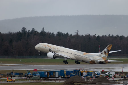 Zurich, Switzerland, January 18, 2024 A6-BMF Etihad Boeing 787-10 Dreamliner aircraft is taking off from runway 28 on a rainy dayのeditorial素材