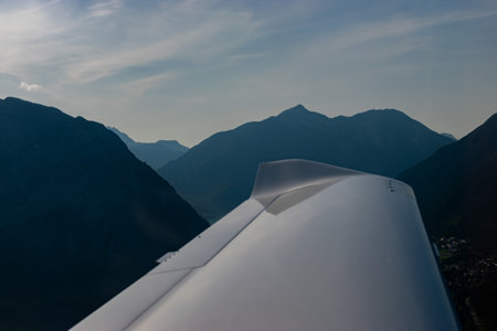 Innsbruck area, Austria, July 30, 2024 Stunning mountain panorama during a flight in a small planeの写真素材