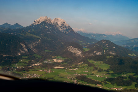 Kufstein, Austria, July 30, 2024 Majestic Kaiser mountains during a flight in a small planeの写真素材