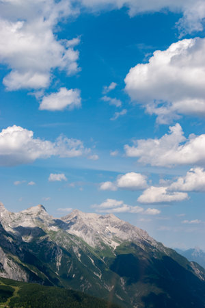 Arlberg pass, Austria, July 30, 2024 Incredible mountain panorama during a flight over the peak on a sunny dayの写真素材