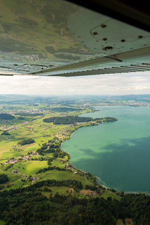 Switzerland, August 19, 2024 View over the lake of Zug during a flight in a small planeの写真素材