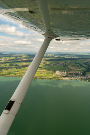 Sempach, Switzerland, August 19, 2024 View over the lake Sempach during a flight in a small plane
