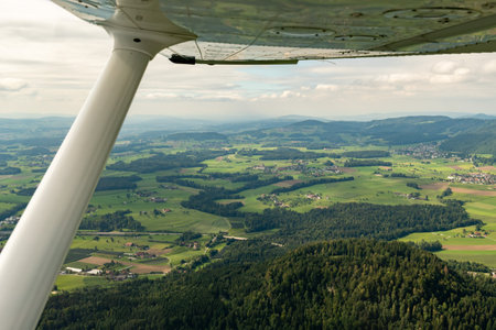 Switzerland, August 19, 2024 Countryside and alpine scenery during a flight in a small plane