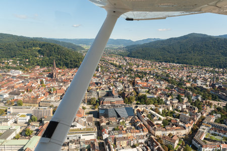 Freiburg, Germany, September 15, 2024 View over the city center during a flight in a small planeの写真素材
