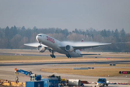 Zurich, Switzerland, January 21, 2026 HB-JNG Swiss Boeing 777-3DEER aircraft is taking off from...