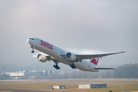 Zurich, Switzerland, January 21, 2026 HB-JNG Swiss Boeing 777-3DEER aircraft is taking off from...