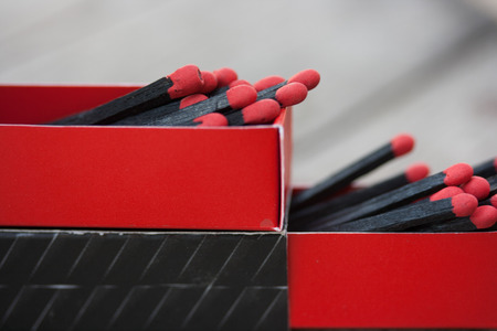 Black matches on wooden texture backgroundの写真素材