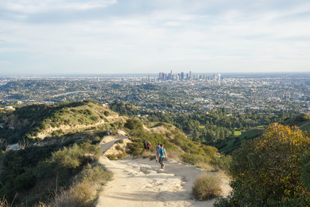 People out hiking Griffith Park trails. Downtown Los Angeles, off in the distance.の写真素材