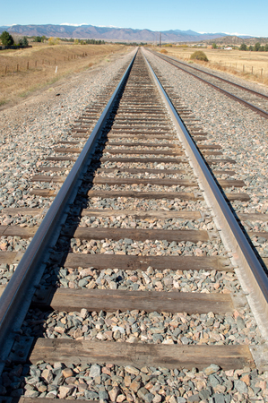 Colorado railroad track leading to the Rocky Mountainsの写真素材