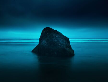 Rock and ocean at dusk, low tide. Washington coast. Washington travel. Ruby Beach.の写真素材