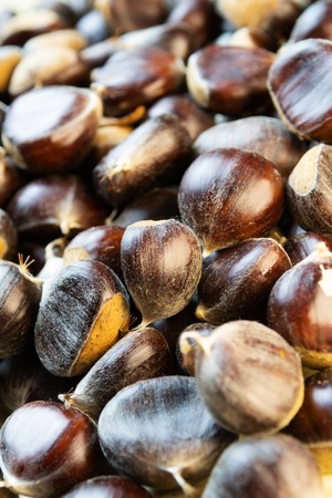 Closeup of beautiful pile of ripe raw chestnutsの写真素材