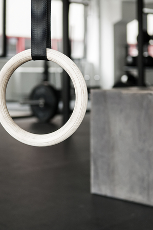 Closeup of gymnastics ring, box and functional training gym interior in backgroundの写真素材