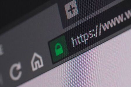 Web browser closeup on LCD screen with depth of field and focus on https word. Internet security, SSL certificate, cybersecurity, search engine and web browser conceptsの写真素材