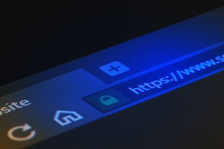 Web browser closeup on LCD screen with shallow focus on https word. Internet security, SSL certificate, cybersecurity, search engine and web browser conceptsの写真素材
