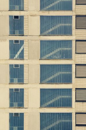 Side of residential building in urban area with visible stairway. Buildings, architecture and...