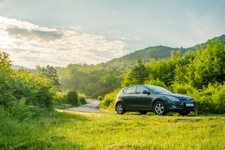 VILSHINKI, UKRAINE - JUNE 10, 2020: Hyundai i 30 hatchback car on a country road in the foggy...