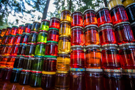 different colored jars of jam. Sweet natural products.の写真素材