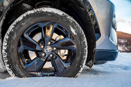 Uzhhorod, Ukraine. January, 2021. Gray car of the Japanese brand Toyota RAV 4 hybrid. SUV,...