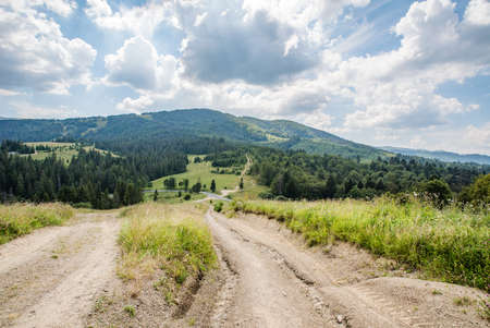 old road on top of mountains of glades and forests. beautiful landscape.の写真素材