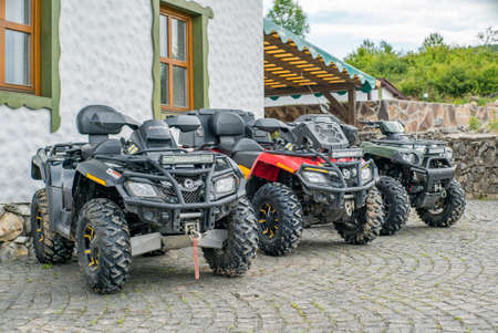 ATVs near the house. Active recreation.のeditorial素材
