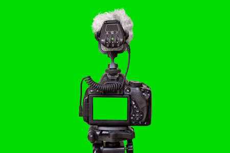 camera isolated on green background. Green screen background. Video blog concept. video camera.の写真素材