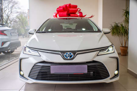 Uzhhorod, Ukraine. March 2021 white car of the Japanese brand Toyota Corolla. Sedan. Reliable and beautiful car.のeditorial素材