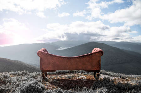 The sofa in the mountains. creative. landscape. style. dedicated sofa in the background of the...