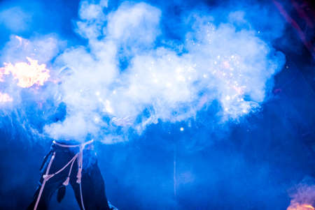 Uzhhorod, Ukraine - April 30, 2018: Feast of Fire. man burns fire. Blurred background of fire seam at the festival.のeditorial素材