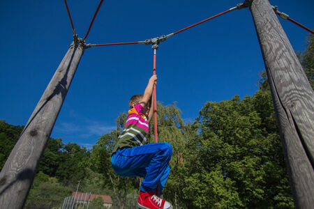 Climb and jump close up of a childの写真素材