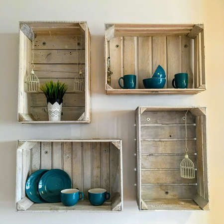 Composition, decoration on the wall from old wooden boxes.