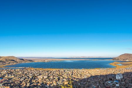 Aerial view of the Puno coastline with Lake Titicaca from the Mirador El Condor in Peru.の写真素材