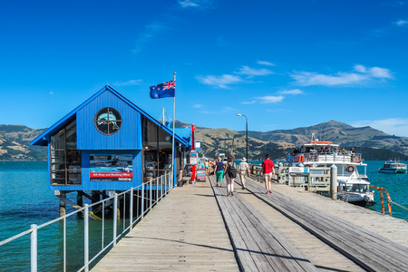 Akaroa, New Zealand - Jan 14, 2018: the tourists are joining the cruise tour at Main Wharf.のeditorial素材