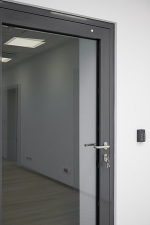 Modern Glass Door with Handle, Keys and Security Panelの写真素材