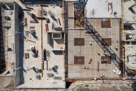 Aerial Top View of a Construction Site with Workers and Rebar