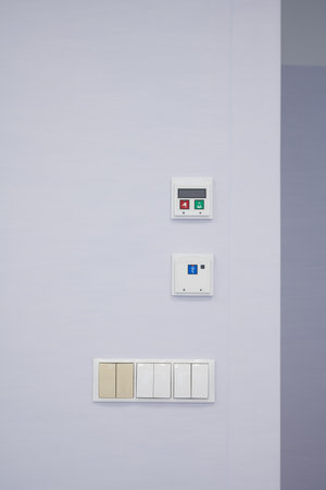 Modern Control Panels and Electrical Outlets on a hospital Wall