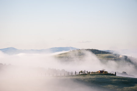 Foggy Rolling Hills in Tuscany, Italyの写真素材