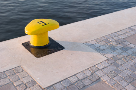 Yellow Bollard and Cobblestone Pavement in Szczecin Poland