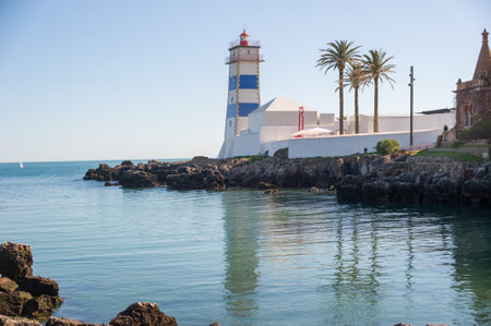 Santa Marta Lighthouse and Coastal Buildings in Cascais, Portugalの写真素材