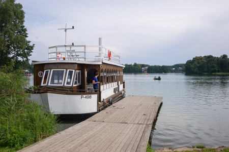 Tour Boat Docked on Lake GalvÄ in Trakai, Lithuaniaの写真素材