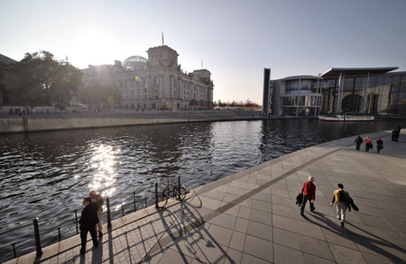Berlin Riverfront with Reichstag and Peopleの写真素材