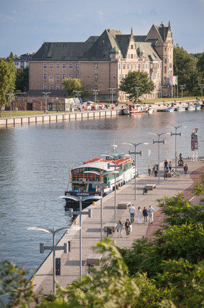 Szczecin Riverfront with Ferry and People Walking