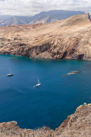 Coastal View with Sailboats and Rocky Cliffs. Madeira Portugalの写真素材